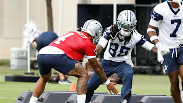 Jun 10, 2025; Arlington, TX, USA;  Dallas Cowboys quarterback Dak Prescott (4) celebrates with Dallas Cowboys wide receiver CeeDee Lamb (88) during a drill at the Ford Center at the Star Training Facility in Frisco, Texas. Mandatory Credit: Chris Jones-Imagn Images