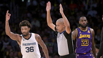 Jan 5, 2024; Los Angeles, California, USA; Memphis Grizzlies guard Marcus Smart (36) heads down court after a 3-point basket in the first half against the Los Angeles Lakers at Crypto.com Arena. Mandatory Credit: Jayne Kamin-Oncea-Imagn Images