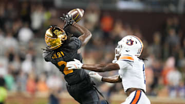Aug 29, 2025; Waco, Texas, USA; Baylor Bears wide receiver Kole Wilson (2) makes a catch against Auburn Tigers safety Champ Anthony (1) during the second half at McLane Stadium. Mandatory Credit: Chris Jones-Imagn Images