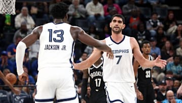 Feb 26, 2024; Memphis, Tennessee, USA; Memphis Grizzlies forward-center Santi Aldama (7) reacts with forward-center Jaren Jackson Jr. (13) during the second half against the Brooklyn Nets at FedExForum. Mandatory Credit: Petre Thomas-Imagn Images