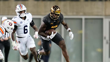Aug 29, 2025; Waco, Texas, USA;  Baylor Bears tight end Michael Trigg (1) runs with the ball after the catch ahead of Auburn Tigers linebacker Demarcus Riddick (6) during the first half at McLane Stadium. Mandatory Credit: Chris Jones-Imagn Images