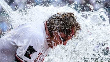 Minnesota Twins left fielder Harrison Bader (12) is doused with water after hitting a solo walk-off home run against the Tampa Bay Rays during the ninth inning at Target Field. 