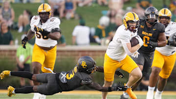 Sep 20, 2025; Waco, Texas, USA; Arizona State Sun Devils quarterback Sam Leavitt (10) breaks free of a tackle by Baylor Bears safety Devyn Bobby (3) during the first half at McLane Stadium. Mandatory Credit: Chris Jones-Imagn Images