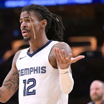 Memphis Grizzlies guard Ja Morant (12) reacts in the second half against the Los Angeles Lakers at Crypto.com Arena. Mandatory Credit: Jayne Kamin-Oncea-Imagn Images