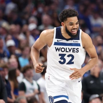 May 28, 2024; Dallas, Texas, USA; Minnesota Timberwolves center Karl-Anthony Towns (32) reacts against the Dallas Mavericks during the fourth quarter of game four of the western conference finals for the 2024 NBA playoffs at American Airlines Center. Mandatory Credit: Kevin Jairaj-USA TODAY Sports