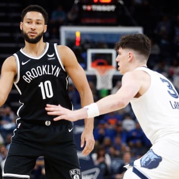 Feb 26, 2024; Memphis, Tennessee, USA; Brooklyn Nets guard Ben Simmons (10) passes the ball as Memphis Grizzlies forward Jake LaRavia (3) defends during the second half at FedExForum. Mandatory Credit: Petre Thomas-USA TODAY Sports