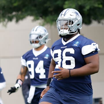 Dallas Cowboys defensive tackle Justin Rogers goes through a drill during practice at the Ford Center at The Star Training Facility 