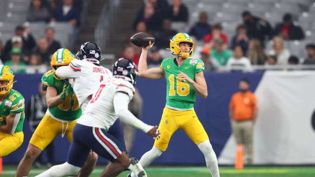 Oregon Ducks quarterback Austin Novosad (16) throws against the Liberty Flames