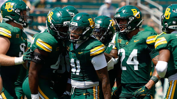 Baylor Bears linebacker Kaleb Burns (41)celebrates with teammates after catching an interception against the Samford Bulldogs