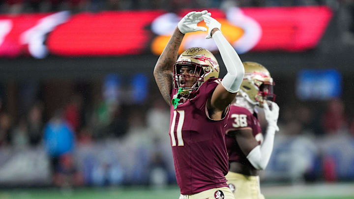 Dec 2, 2023; Charlotte, NC, USA; Florida State Seminoles defensive lineman Patrick Payton (11) reacts during the fourth quarter against the Louisville Cardinals at Bank of America Stadium. Mandatory Credit: Jim Dedmon-Imagn Images