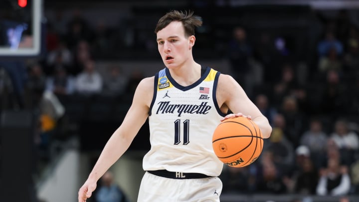 Mar 24, 2024; Indianapolis, IN, USA; Marquette Golden Eagles guard Tyler Kolek (11) dribbles against the Colorado Buffaloes during the first half at Gainbridge FieldHouse. Mandatory Credit: Trevor Ruszkowski-USA TODAY Sports