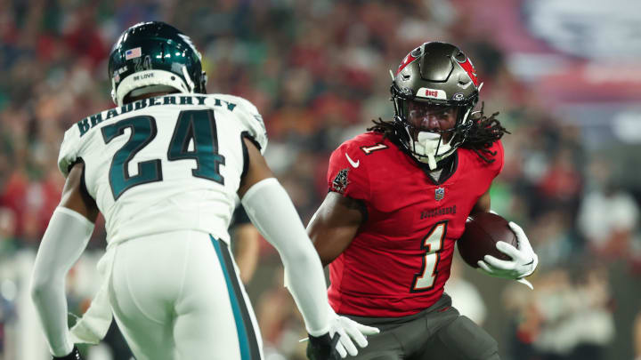 Jan 15, 2024; Tampa, Florida, USA; Tampa Bay Buccaneers running back Rachaad White (1) runs the ball as Philadelphia Eagles cornerback James Bradberry (24) defends during the first half of a 2024 NFC wild card game at Raymond James Stadium. Mandatory Credit: Kim Klement Neitzel-USA TODAY Sports