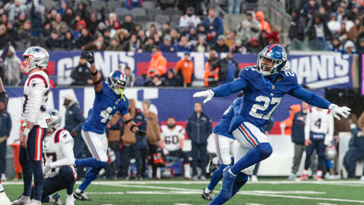 Nov 26, 2023; East Rutherford, New Jersey, USA;  New York Giants safety Jason Pinnock (27) celebrates after New England Patriots placekicker Chad Ryland (37) misses a field goal during the fourth quarter at MetLife Stadium.  