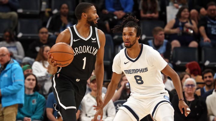 Feb 26, 2024; Memphis, Tennessee, USA; Brooklyn Nets forward Mikal Bridges (1) dribbles as Memphis Grizzlies forward Ziaire Williams (8) defends during the first half at FedExForum. Mandatory Credit: Petre Thomas-USA TODAY Sports