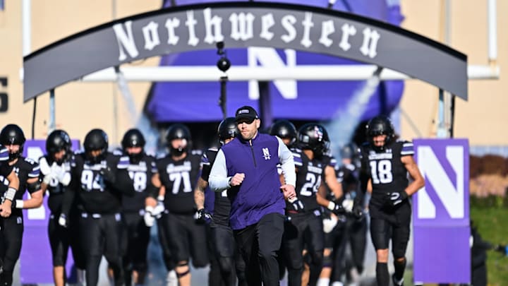 Nov 18, 2023; Evanston, Illinois, USA; Northwestern Wildcats head coach David Braun leads his team onto the field before a game against the Purdue Boilermakers at Ryan Field. Mandatory Credit: Jamie Sabau-Imagn Images Nov 18, 2023; Evanston, Illinois, USA; Northwestern Wildcats head coach David Braun leads his team onto the field before a game against the Purdue Boilermakers at Ryan Field. Mandatory Credit: Jamie Sabau-Imagn Images