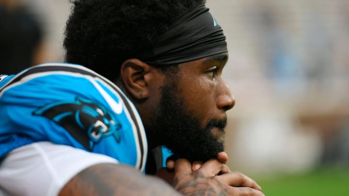 Carolina Panther Miles Sanders (6) takes a moment during warm-ups at Memorial Stadium the Panthers Fan Fest in Clemson, S.C., on Thursday, Aug. 1, 2024.