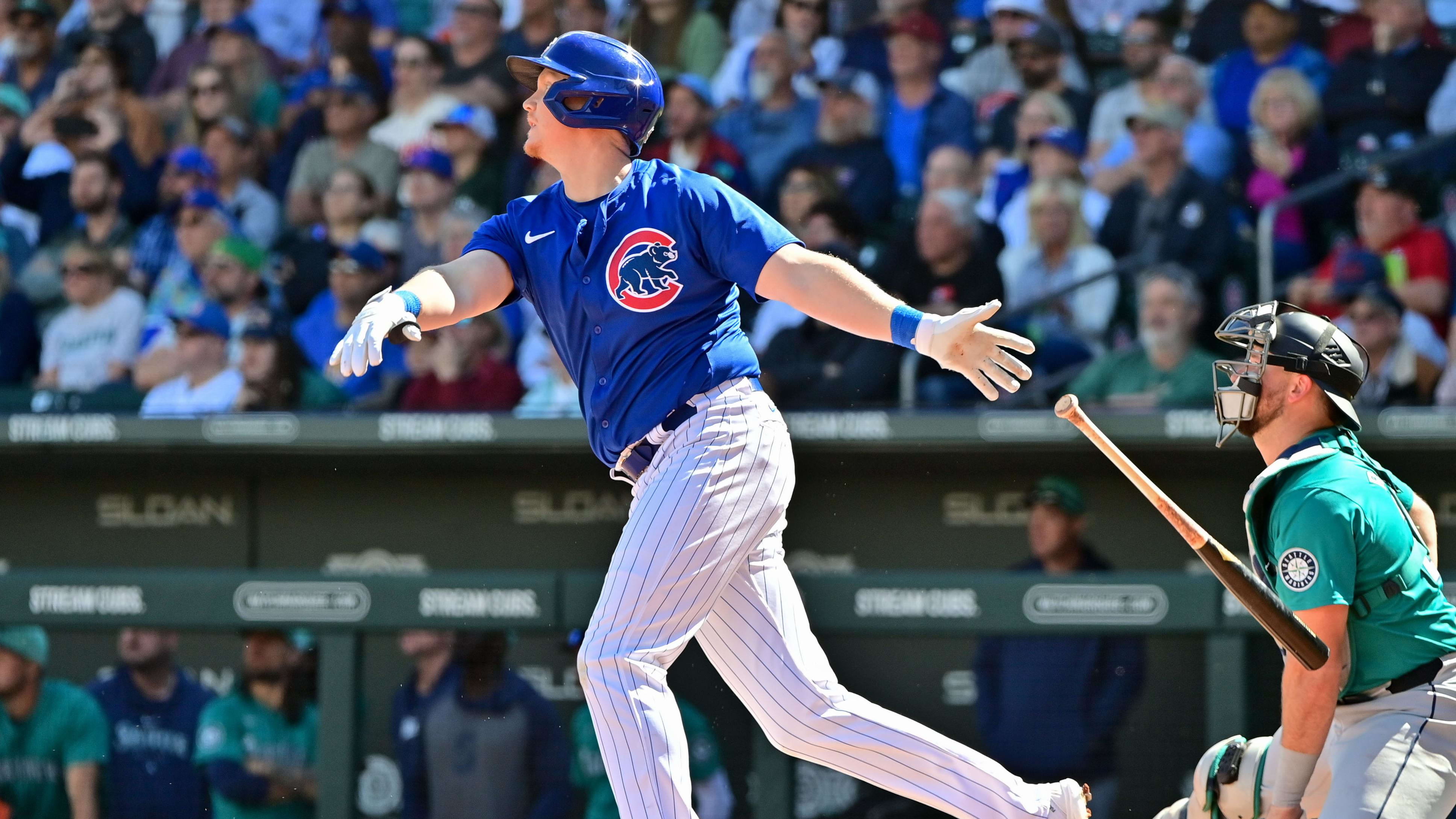 Mar 8, 2024; Mesa, Arizona, USA;  Chicago Cubs designated hitter Garrett Cooper (41) hits a three-run home run.