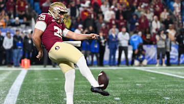 Dec 2, 2023; Charlotte, NC, USA; Florida State Seminoles punter Alex Mastromanno (29) punts the ball against the Louisville Cardinals in the first quarter at Bank of America Stadium. Mandatory Credit: Bob Donnan-Imagn Images