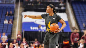 Mar 8, 2024; Greensboro, NC, USA; Miami Hurricanes guard Jasmyne Roberts (4) on the court in the second half at against the Virginia Tech Hokies Greensboro Coliseum. Mandatory Credit: David Yeazell-Imagn Images