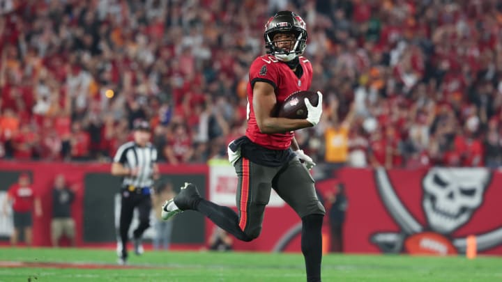 Jan 15, 2024; Tampa, Florida, USA; Tampa Bay Buccaneers wide receiver Trey Palmer (10) runs for a touchdown after a reception against the Philadelphia Eagles during the second half of a 2024 NFC wild card game at Raymond James Stadium. Mandatory Credit: Kim Klement Neitzel-USA TODAY Sports