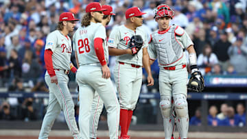 Oct 9, 2024; New York, New York, USA; Philadelphia Phillies pitcher Ranger Suarez (55) meets with teammates on the mound against the New York Mets in game four of the NLDS for the 2024 MLB Playoffs at Citi Field.