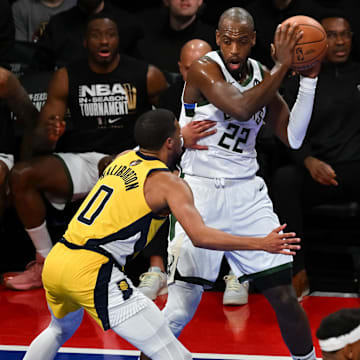 Dec 7, 2023; Las Vegas, Nevada, USA; Milwaukee Bucks forward Khris Middleton (22) holds the ball as Indiana Pacers guard Tyrese Haliburton (0) closes him down on defense during the third quarter at T-Mobile Arena. Mandatory Credit: Candice Ward-Imagn Images