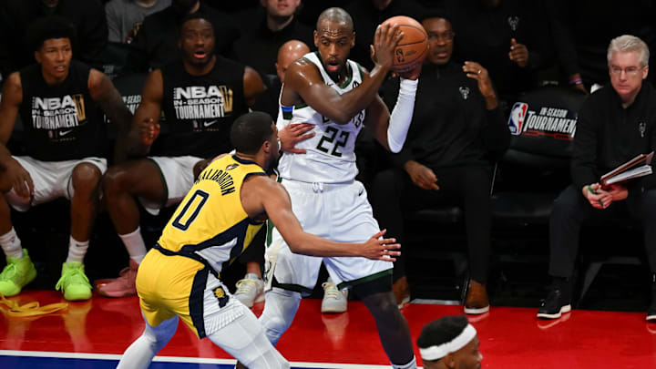 Dec 7, 2023; Las Vegas, Nevada, USA; Milwaukee Bucks forward Khris Middleton (22) holds the ball as Indiana Pacers guard Tyrese Haliburton (0) closes him down on defense during the third quarter at T-Mobile Arena. Mandatory Credit: Candice Ward-Imagn Images