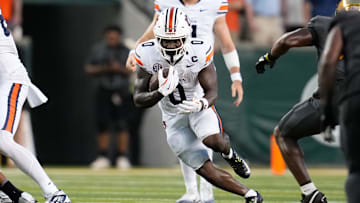 Aug 29, 2025; Waco, Texas, USA;  Auburn Tigers running back Damari Alston (0) runs the ball against the Baylor Bears during the first half at McLane Stadium. Mandatory Credit: Chris Jones-Imagn Images