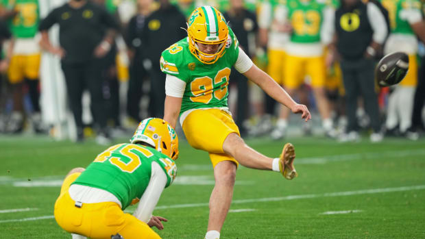 Oregon Ducks place kicker Grant Meadors (93) kicks the ball against the Liberty Flame