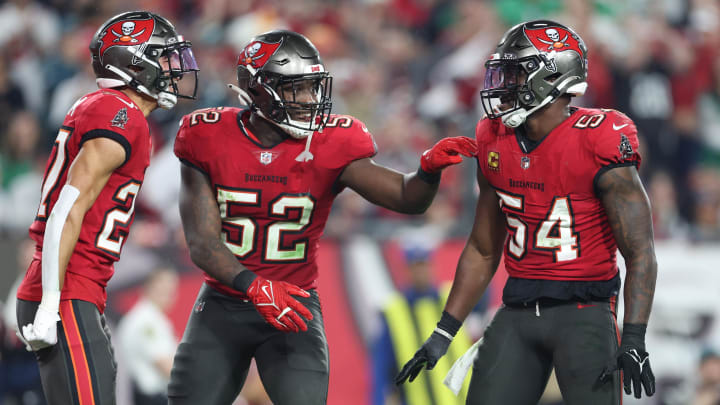 Jan 15, 2024; Tampa, Florida, USA; Tampa Bay Buccaneers linebackers Lavonte David (54), K.J. Britt (52), and cornerback Zyon McCollum (27) reacts after a play against the Philadelphia Eagles during the second half of a 2024 NFC wild card game at Raymond James Stadium. Mandatory Credit: Nathan Ray Seebeck-USA TODAY Sports