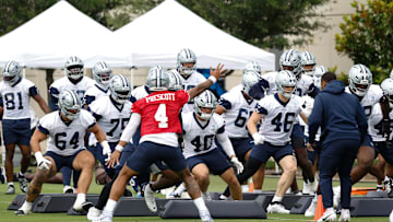 Jun 10, 2025; Arlington, TX, USA;  Dallas Cowboys quarterback Dak Prescott (4) leads teammates through a drill at the Ford Center at the Star Training Facility in Frisco, Texas. Mandatory Credit: Chris Jones-Imagn Images