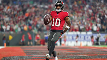 Jan 15, 2024; Tampa, Florida, USA; Tampa Bay Buccaneers wide receiver Trey Palmer (10) runs in a touchdown after a reception against the Philadelphia Eagles during the second half of a 2024 NFC wild card game at Raymond James Stadium. Mandatory Credit: Nathan Ray Seebeck-Imagn Images