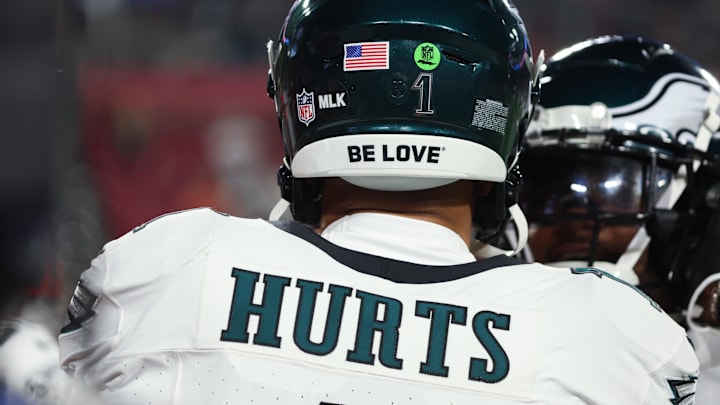 Jan 15, 2024; Tampa, Florida, USA; Philadelphia Eagles quarterback Jalen Hurts (1) wears an MLK sticker on his helmet in observance of Martin Luther King Jr. Day before a 2024 NFC wild card game against the Tampa Bay Buccaneers at Raymond James Stadium. Mandatory Credit: Kim Klement Neitzel-Imagn Images