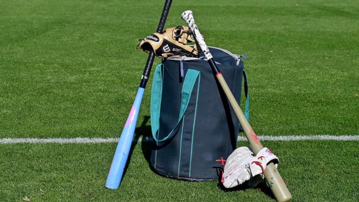 Seattle Mariners bats and gloves are pictured during a Spring Training workout Feb. 15 at Peoria Sports Complex.