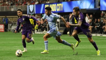 Mar 17, 2024; Atlanta, Georgia, USA;  Atlanta United midfielder Thiago Almada (10) dribbles against Orlando City defender Michael Halliday (26) and midfielder Facundo Torres (10) during the second half at Mercedes-Benz Stadium. Mandatory Credit: Jordan Godfree-USA TODAY Sports