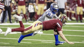 Mar 30, 2024; Detroit, MI, USA; Michigan Panthers quarterback E.J. Perry (4) dives for a first down next to St. Louis Battlehawks linebacker Willie Harvey during the second half at Ford Field. Mandatory Credit: David Reginek-USA TODAY Sports