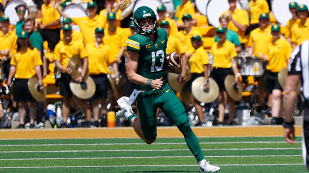 Baylor Bears quarterback Sawyer Robertson (13) carries the ball for a first down against the Samford Bulldogs
