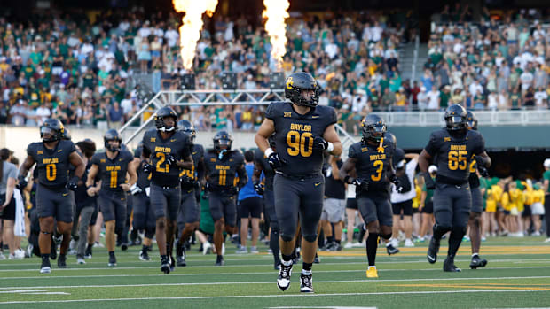 The Baylor Bears take the field before opening kickoff against the Arizona State Sun Devils at McLane Stadium. 