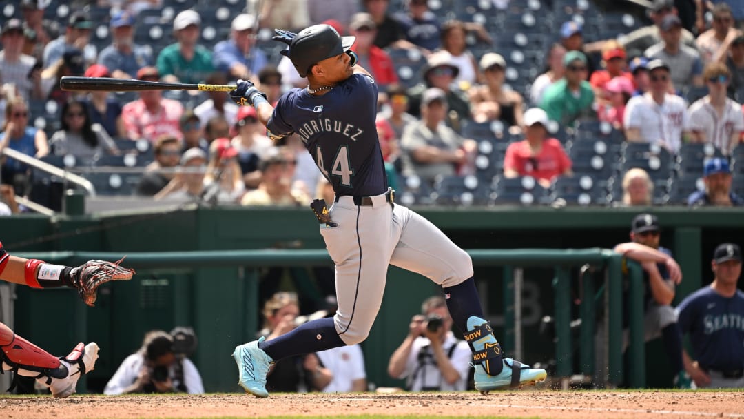 May 26, 2024; Washington, District of Columbia, USA; Seattle Mariners center fielder Julio Rodriguez (44) gets a base hit against the Washington Nationals during the eighth inning at Nationals Park. Mandatory Credit: Rafael Suanes-USA TODAY Sports