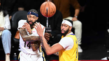 Dec 7, 2023; Las Vegas, Nevada, USA; New Orleans Pelicans forward Brandon Ingram (14) passes the ball as Los Angeles Lakers forward Anthony Davis (3) looks on during the first quarter at T-Mobile Arena. Mandatory Credit: Candice Ward-USA TODAY Sports