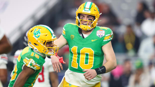 Oregon Ducks quarterback Bo Nix (10) celebrates a touchdown with  wide receiver Tez Johnson