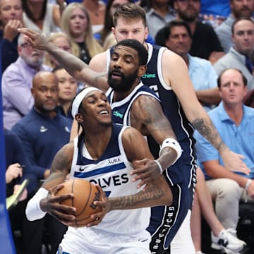 Minnesota Timberwolves forward Jaden McDaniels (3) controls the ball against Dallas Mavericks guard Kyrie Irving (11) during the second quarter of Game 4 of the Western Conference finals at American Airlines Center in Dallas on May 28, 2024.