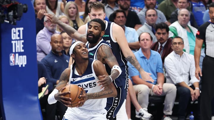 Minnesota Timberwolves forward Jaden McDaniels (3) controls the ball against Dallas Mavericks guard Kyrie Irving (11) during the second quarter of Game 4 of the Western Conference finals at American Airlines Center in Dallas on May 28, 2024.