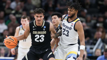 Mar 24, 2024; Indianapolis, IN, USA; Colorado Buffaloes forward Tristan da Silva (23) dribbles against Marquette Golden Eagles forward David Joplin (23) during the first half at Gainbridge FieldHouse. Mandatory Credit: Trevor Ruszkowski-USA TODAY Sports