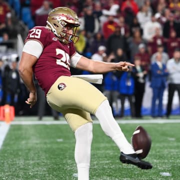 Dec 2, 2023; Charlotte, NC, USA; Florida State Seminoles punter Alex Mastromanno (29) punts the ball against the Louisville Cardinals in the first quarter at Bank of America Stadium. Mandatory Credit: Bob Donnan-USA TODAY Sports