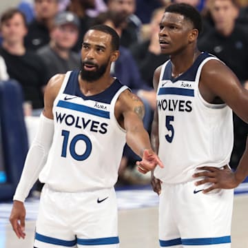 May 28, 2024; Dallas, Texas, USA; Minnesota Timberwolves guard Anthony Edwards (5) and guard Mike Conley (10) speak during the second quarter against the Dallas Mavericks in game four of the western conference finals for the 2024 NBA playoffs at American Airlines Center. Mandatory Credit: Kevin Jairaj-Imagn Images