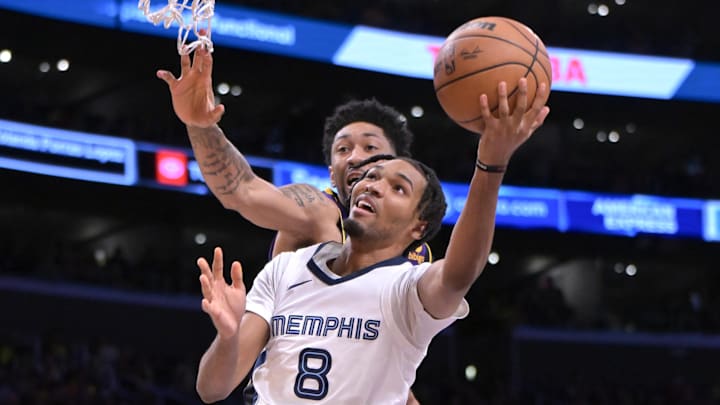 Jan 5, 2024; Los Angeles, California, USA; Los Angeles Lakers forward Christian Wood (35) defends a shot by Memphis Grizzlies forward Ziaire Williams (8) in the second half at Crypto.com Arena. Mandatory Credit: Jayne Kamin-Oncea-Imagn Images