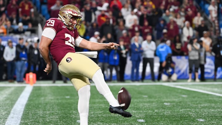 Dec 2, 2023; Charlotte, NC, USA; Florida State Seminoles punter Alex Mastromanno (29) punts the ball against the Louisville Cardinals in the first quarter at Bank of America Stadium. Mandatory Credit: Bob Donnan-USA TODAY Sports