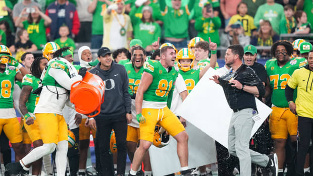 Oregon Ducks head coach Dan Lanning reacts after being doused in Gatorade at the end of the 2024 Fiesta Bowl.