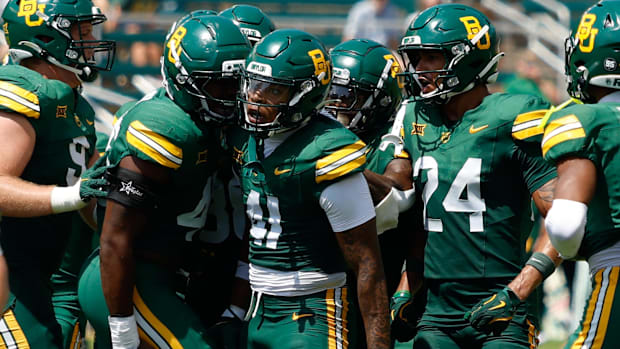 Baylor Bears linebacker Kaleb Burns (41) celebrates with teammates after catching an interception against the Samford Bulldog